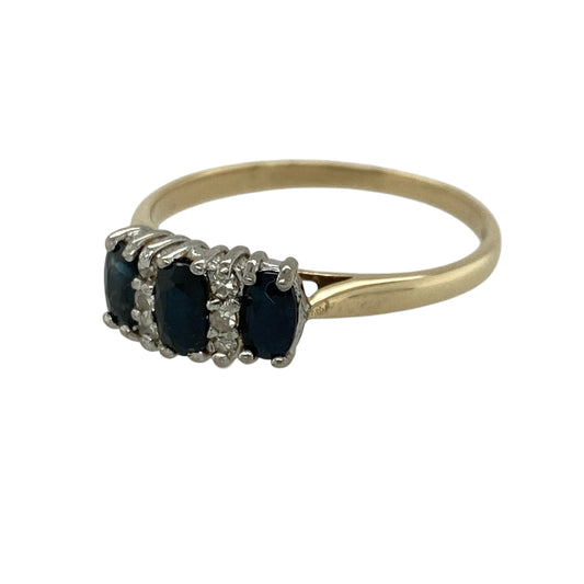 Add a timeless and elegant piece to your jewellery collection with this pre-owned 9ct yellow gold diamond and sapphire set trilogy ring, combining classic design with rich colour and sparkle—perfect for everyday wear or special occasions.

Design: The ring features a traditional trilogy design with three oval sapphires, symbolising past, present, and future, accented by sparkling diamonds for added brilliance.