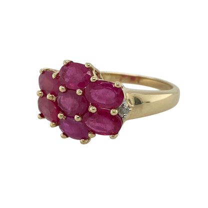 Add a rich and elegant piece to your jewellery collection with this pre-owned 9ct yellow gold diamond and ruby set cluster ring, combining vibrant colour with classic sparkle—perfect for special occasions or everyday sophistication.

Design: The ring features a striking cluster design, showcasing oval ruby stones arranged to create a bold and eye-catching centre, complemented by diamond accents for added brilliance.