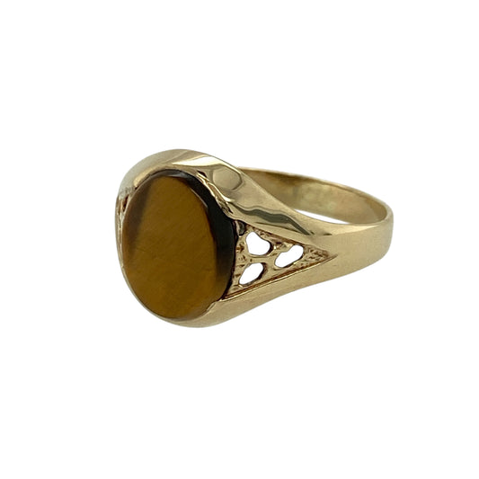 Add a bold and distinctive piece to your jewellery collection with this pre-owned 9ct yellow gold tiger’s eye oval signet ring, combining classic styling with rich natural character—perfect for everyday wear or making a subtle statement.

Design: The ring features a traditional oval signet design, set with a striking tiger’s eye gemstone that displays its characteristic golden-brown bands and chatoyancy.