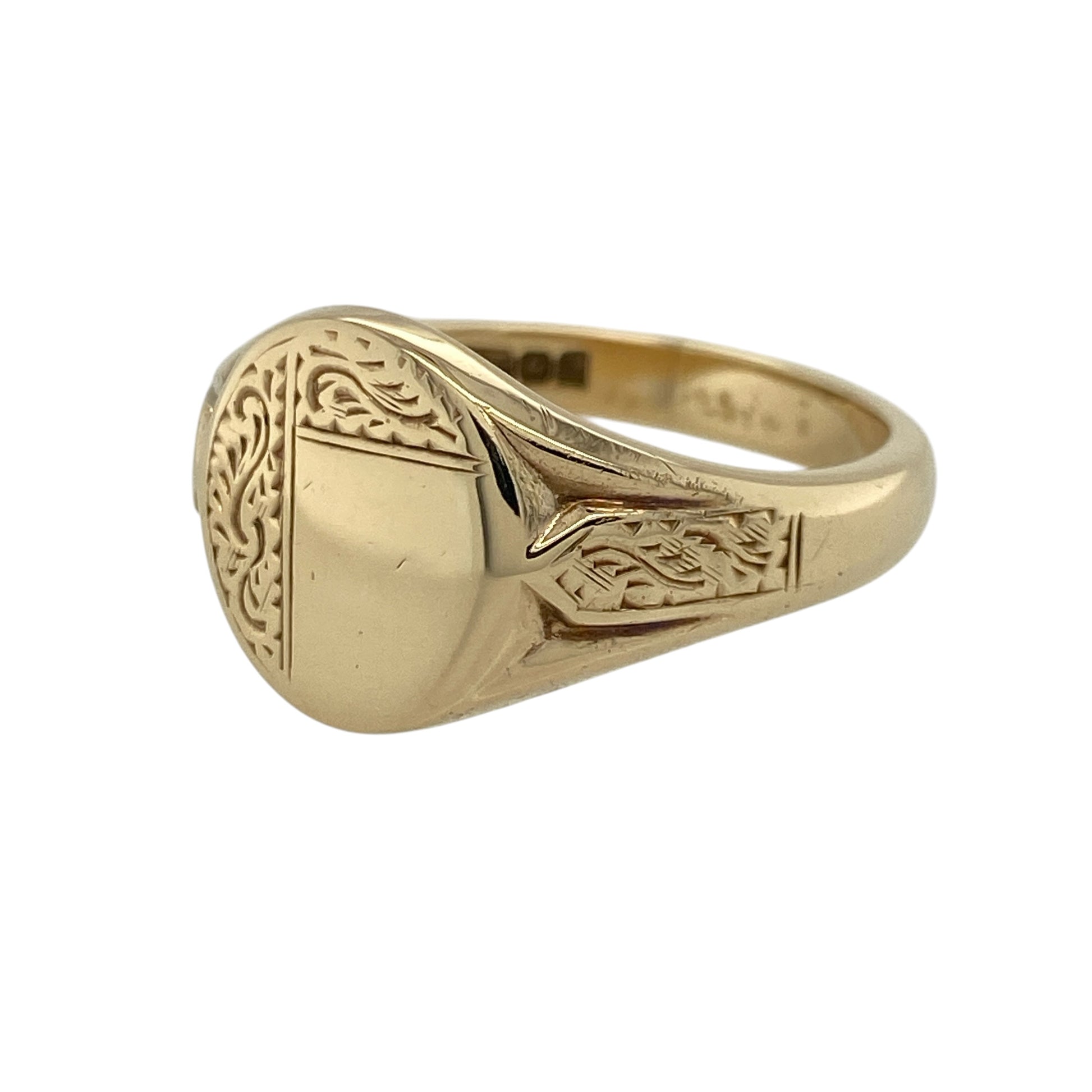 Add a bold and classic piece to your jewellery collection with this pre-owned 9ct yellow gold patterned oval signet ring, combining traditional style with eye-catching detail—perfect for everyday wear or making a statement.

Design: The ring features a large oval signet face with an engraved patterned finish, creating a distinctive and textured appearance.
Material: Made from 9-carat yellow gold, it has a polished and patterned surface that enhances its warm tone and classic appeal.