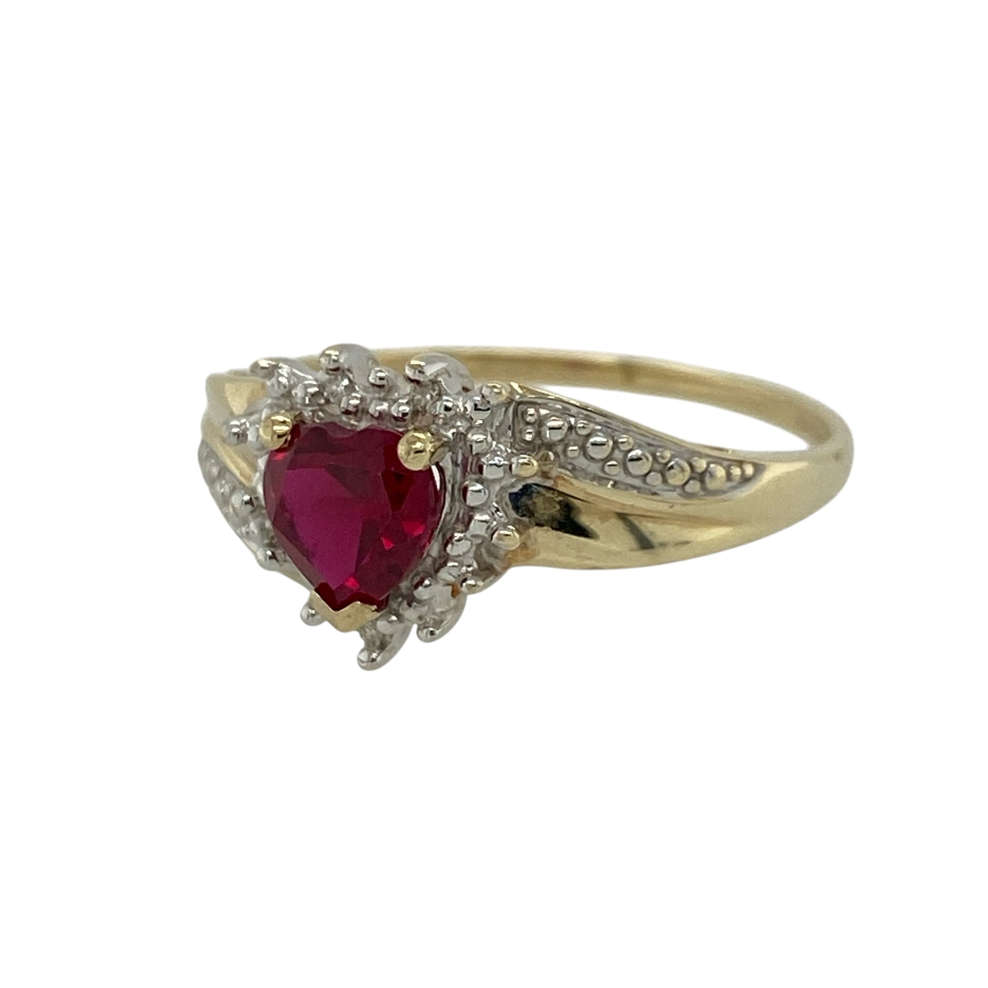 Add a romantic and eye-catching piece to your jewellery collection with this pre-owned 9ct yellow gold diamond and ruby set heart cluster ring, combining rich colour with delicate sparkle—perfect for special occasions or meaningful gifting.

Design: The ring features a heart-shaped cluster design, centred with a ruby and surrounded by sparkling diamonds to create a bold and feminine look.