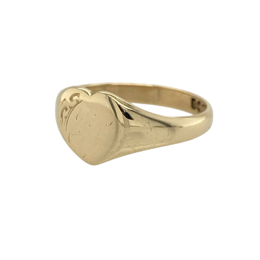 Add a romantic and timeless piece to your jewellery collection with this pre-owned 9ct yellow gold heart signet ring, combining classic style with a subtle decorative touch—perfect for everyday wear or as a meaningful gift.

Design: The ring features a traditional heart-shaped signet face with a small patterned corner detail, adding a unique and delicate accent to the design.
Material: Made from 9-carat yellow gold, it has a polished finish that enhances its warm tone and classic appeal.