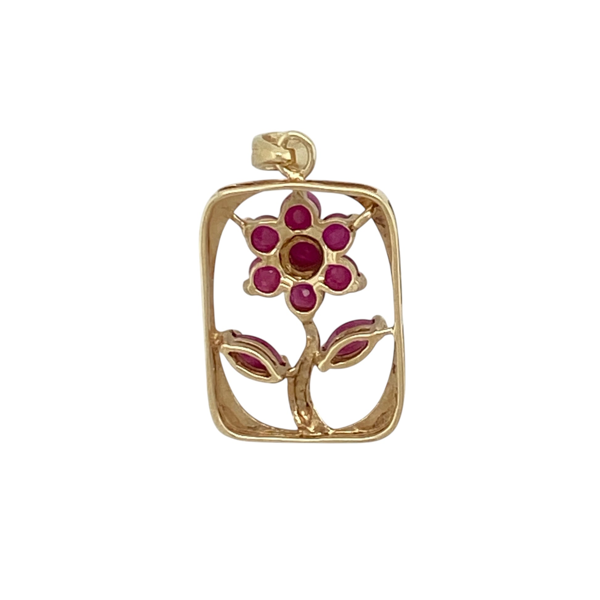 Add a touch of colour and vintage-inspired charm to your jewellery collection with this pre-owned 9ct yellow gold ruby set flower in a rectangle surround pendant, combining classic design with elegant detail—perfect for everyday wear or special occasions.

Design: The pendant features a floral motif set within a rectangular frame, creating a structured yet delicate look with a timeless appeal.