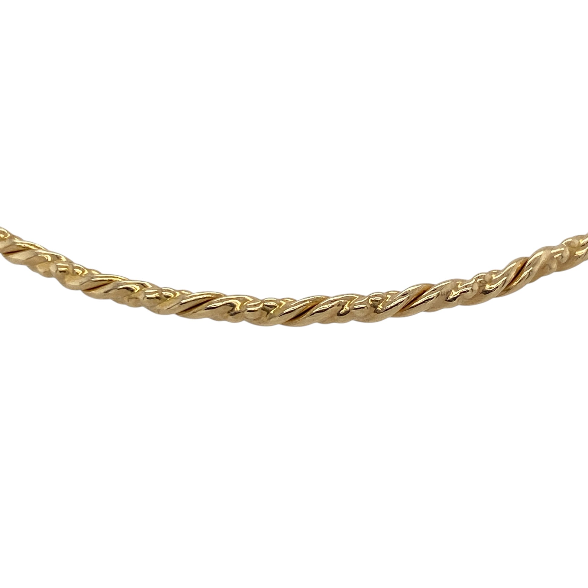 Add a touch of subtle texture to your jewellery collection with this pre-owned 9ct yellow gold twisted bangle, offering a timeless design with a refined finish—perfect for everyday wear or stacking.

Design: The bangle features a slim twisted design, creating a delicate and light-catching effect that adds gentle detail to a classic shape.
Material: Made from 9-carat yellow gold, it has a polished finish that enhances its warm tone and highlights the twisted pattern.