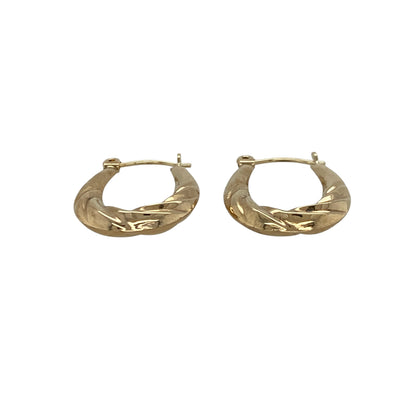 Add a subtle and stylish touch to your jewellery collection with these pre-owned 9ct yellow gold small twisted oval creole earrings, combining classic shape with delicate detail—perfect for everyday wear.

Design: The earrings feature a small oval creole shape with a twisted design, creating a gentle and light-catching effect.
Material: Made from 9-carat yellow gold, they have a polished finish that enhances their warm tone and highlights the twist detail.