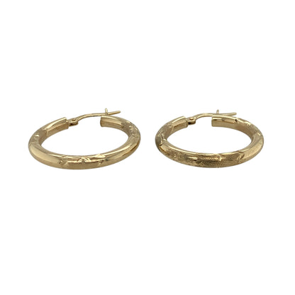 Add a touch of texture and timeless style to your jewellery collection with these pre-owned 9ct yellow gold patterned hoop creole earrings, offering classic design with decorative detail—perfect for everyday wear.

Design: The earrings feature a traditional hoop creole shape with an all-over patterned finish, creating subtle sparkle and visual interest.
Material: Made from 9-carat yellow gold, they have a polished and textured surface that enhances their warm tone and decorative appeal.