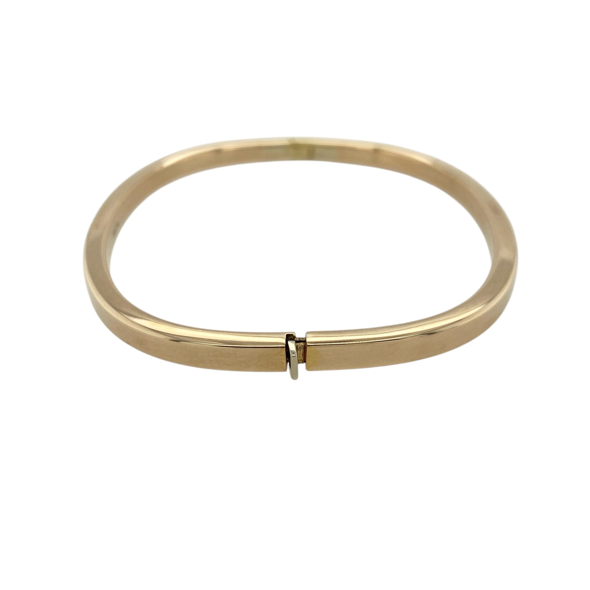 Add a sleek and contemporary piece to your jewellery collection with this pre-owned 9ct yellow gold plain squared hinged bangle, combining modern shape with timeless style—perfect for everyday wear or special occasions.

Design: The bangle features a distinctive squared profile with a smooth, plain finish, creating a clean and structured look.
Material: Made from 9-carat yellow gold, it has a polished surface that enhances its warm tone and modern appeal.