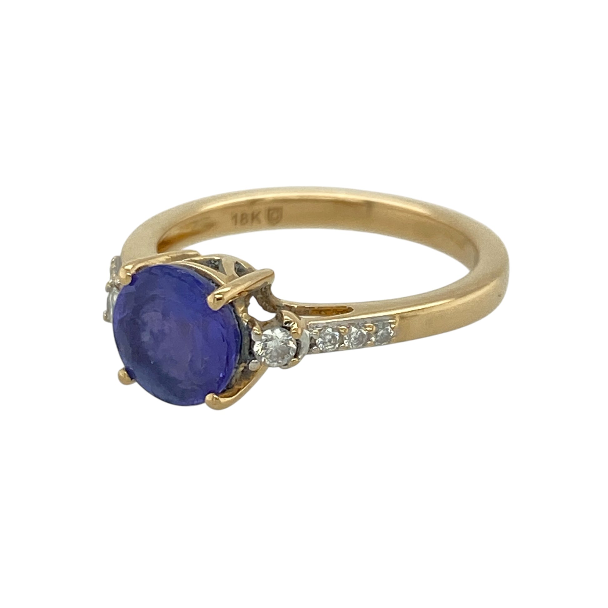 Add a striking and elegant piece to your jewellery collection with this pre-owned 18ct yellow gold diamond and purple/blue stone set ring, combining rich colour with classic sparkle—perfect for special occasions or everyday luxury.

Design: The ring features a central round purple/blue stone, complemented by diamond accents on the shoulders, creating a balanced and eye-catching look.
