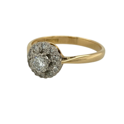Add a timeless and elegant piece to your jewellery collection with this pre-owned 18ct yellow gold and platinum diamond set flower cluster ring, combining classic design with delicate sparkle—perfect for special occasions or everyday wear.

Design: The ring features a refined flower cluster design, with diamonds arranged to form a soft floral shape that creates a balanced and eye-catching look.