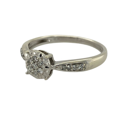 Add a touch of brilliance to your jewellery collection with this pre-owned 9ct white gold diamond illusion set cluster ring, combining classic design with enhanced sparkle—perfect for everyday wear or special occasions.

Design: The ring features a central illusion set diamond cluster, designed to maximise the appearance of size and sparkle, with additional diamonds set along the shoulders for added elegance.