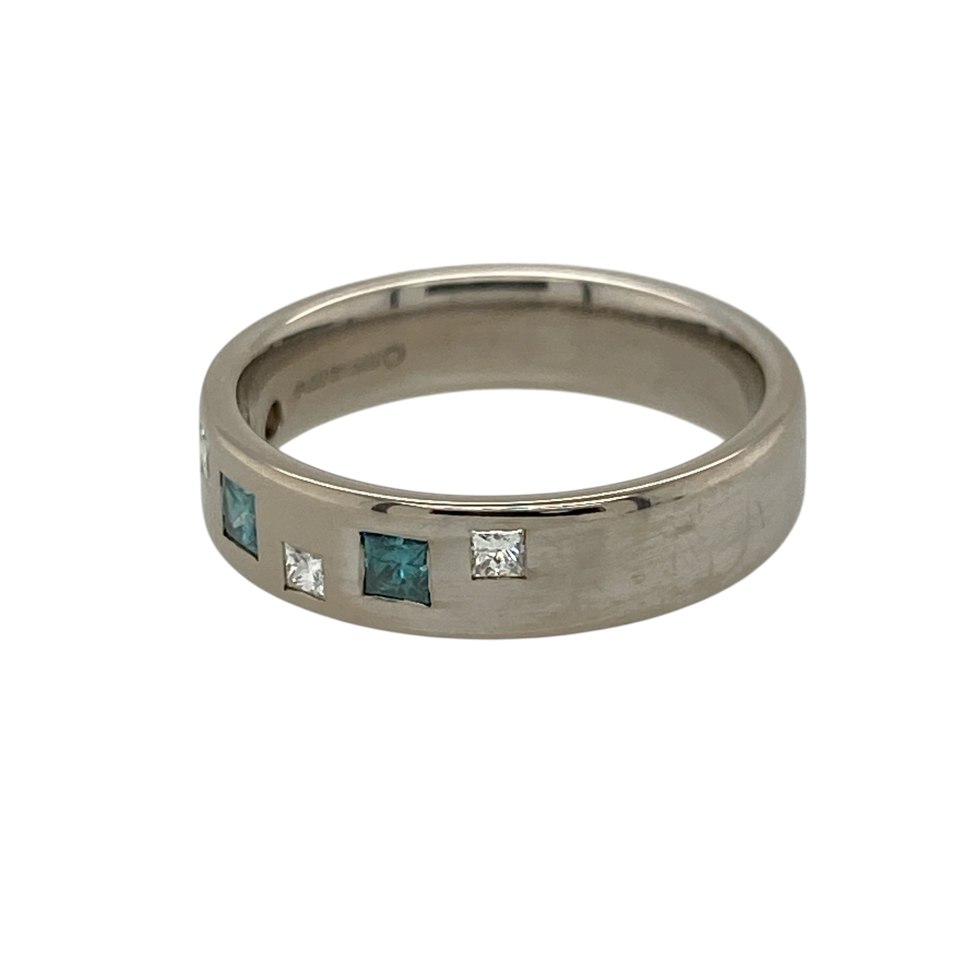 Add a bold and luxurious piece to your jewellery collection with this pre-owned 18ct white gold diamond set band ring, combining contemporary design with striking colour contrast—perfect for everyday wear or special occasions.

Design: The ring features a wide band design set with princess cut diamonds in both blue and white tones, creating a modern and eye-catching geometric look.