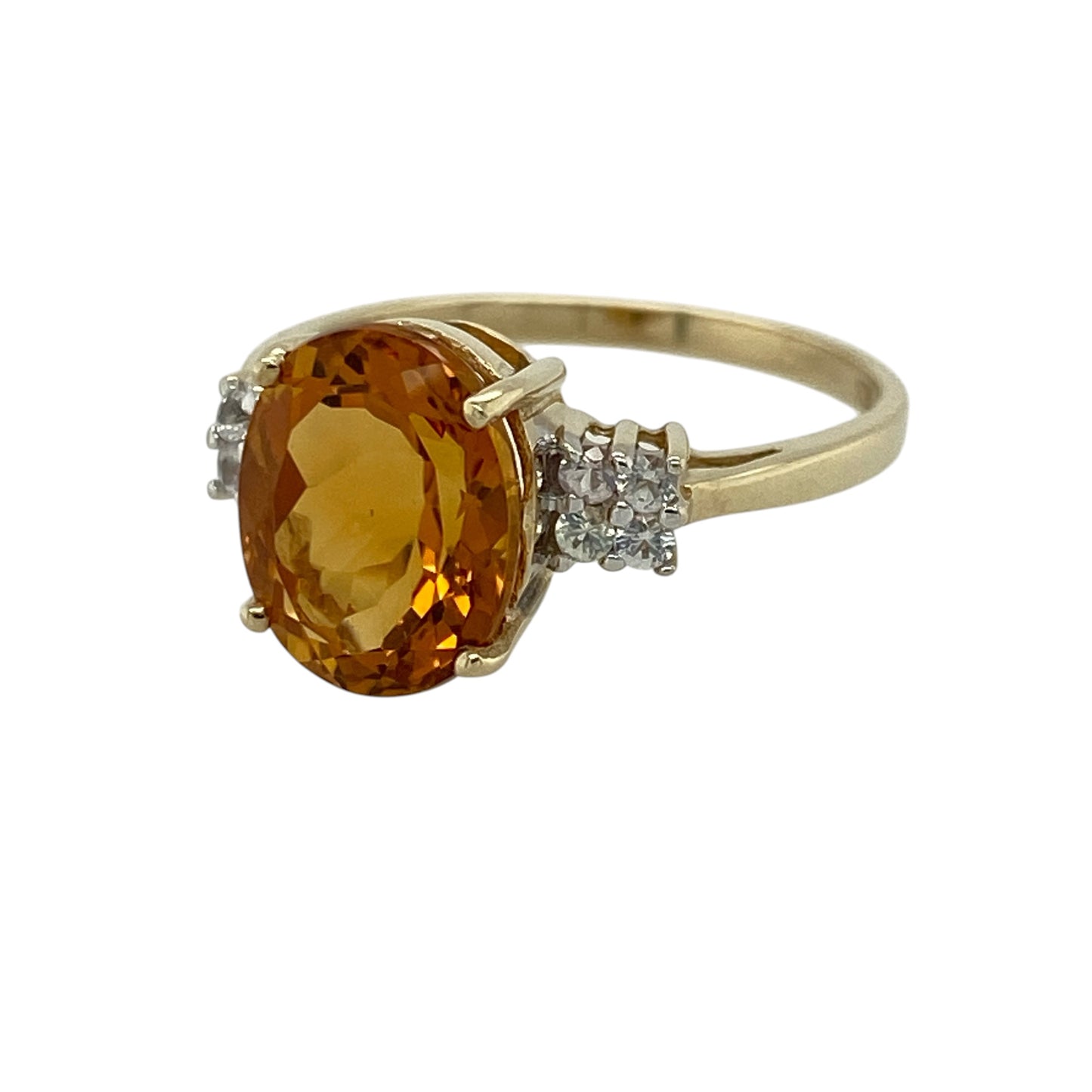 Add a vibrant and eye-catching piece to your jewellery collection with this pre-owned 9ct yellow gold orange stone and cubic zirconia set ring, combining bold colour with elegant sparkle—perfect for everyday wear or special occasions.

Design: The ring features a striking oval orange stone at the centre, complemented by cubic zirconia accents along the sides for added brilliance and balance.