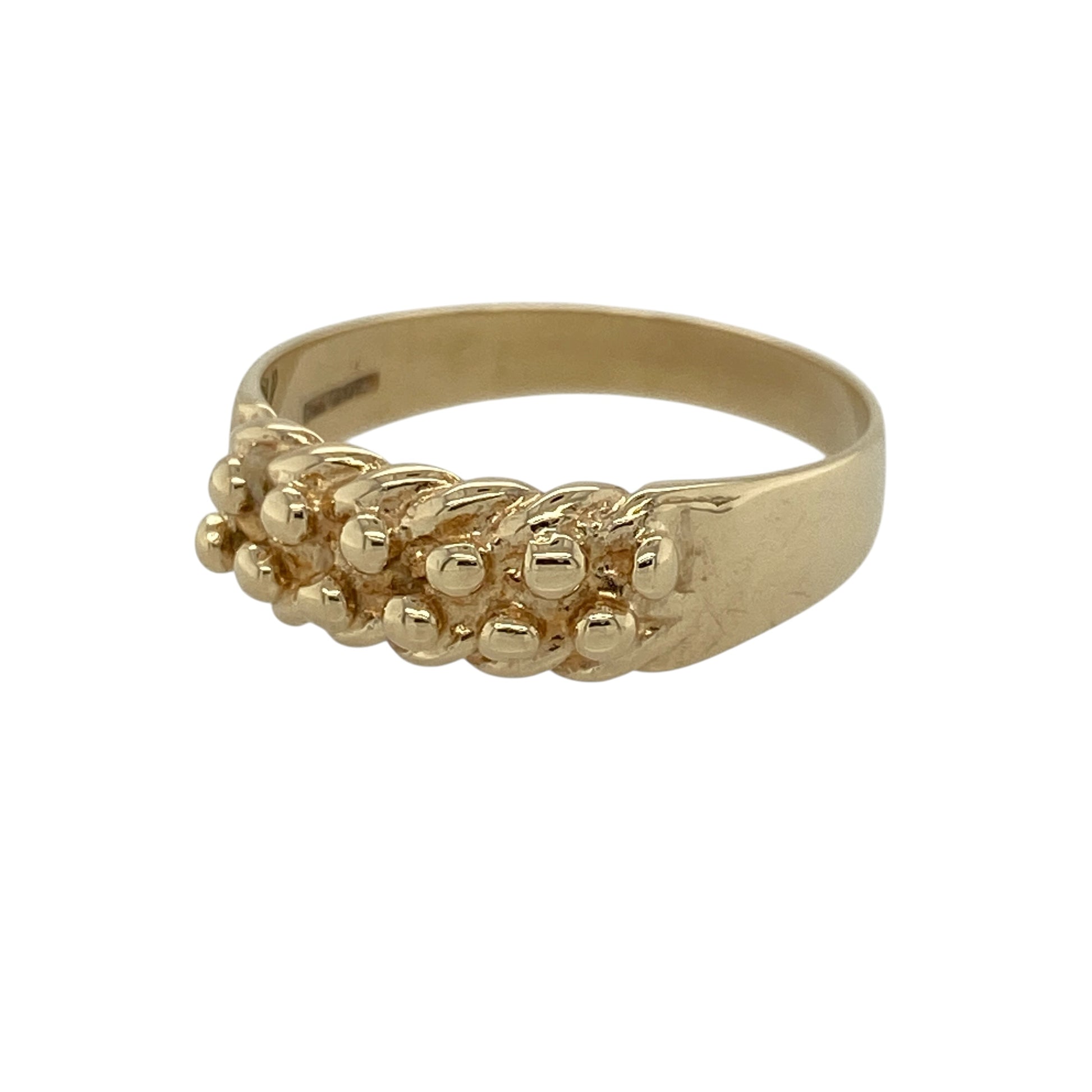 Add a classic and characterful piece to your jewellery collection with this pre-owned 9ct yellow gold double row keeper ring, combining traditional design with a refined look—perfect for everyday wear or making a subtle statement.

Design: The ring features a double row keeper style with interwoven detailing across the front, creating a textured and timeless appearance.
Material: Made from 9-carat yellow gold, it has a polished finish that enhances its warm tone and highlights the intricate design.