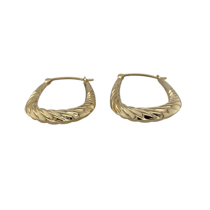 Add a stylish and elegant touch to your jewellery collection with these pre-owned 9ct yellow gold twisted oval creole earrings, combining classic shape with a modern twist—perfect for everyday wear or special occasions.

Design: The earrings feature an oval creole shape with a twisted design, creating a flowing and light-catching look that adds subtle texture.
Material: Made from 9-carat yellow gold, they have a polished finish that enhances their warm tone and highlights the twist detail.