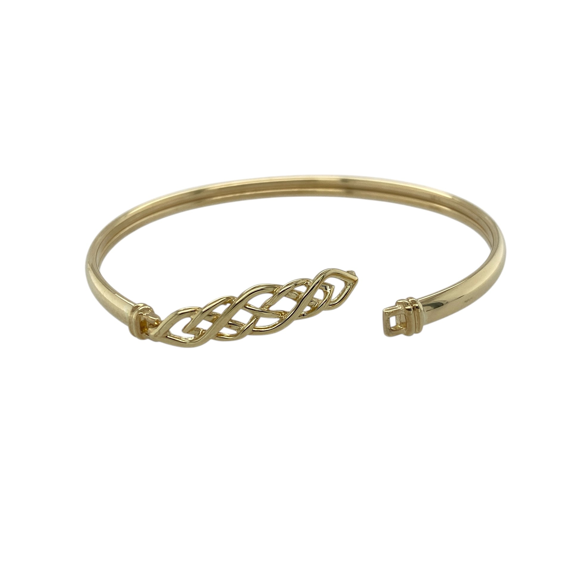 Add a meaningful and stylish piece to your jewellery collection with this pre-owned 9ct yellow gold Celtic knot hinged bangle, combining traditional symbolism with a bold design—perfect for everyday wear or special occasions.

Design: The bangle features a Celtic knot design across the front, symbolising eternity and connection, with intricate detailing that creates a distinctive look.