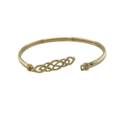 Add a meaningful and stylish piece to your jewellery collection with this pre-owned 9ct yellow gold Celtic knot hinged bangle, combining traditional symbolism with a bold design—perfect for everyday wear or special occasions.

Design: The bangle features a Celtic knot design across the front, symbolising eternity and connection, with intricate detailing that creates a distinctive look.