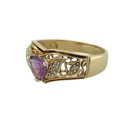 Bring graceful design and a pop of rich colour to your jewellery collection with this pre-owned 9ct yellow gold diamond and amethyst set open patterned wishbone ring—perfect for stacking or making a subtle statement.

Design: This wishbone-style ring features an open patterned front, adorned with vibrant amethyst gemstones and delicate diamonds that add a touch of sparkle. The 9mm wide front creates an eye-catching yet elegant silhouette.