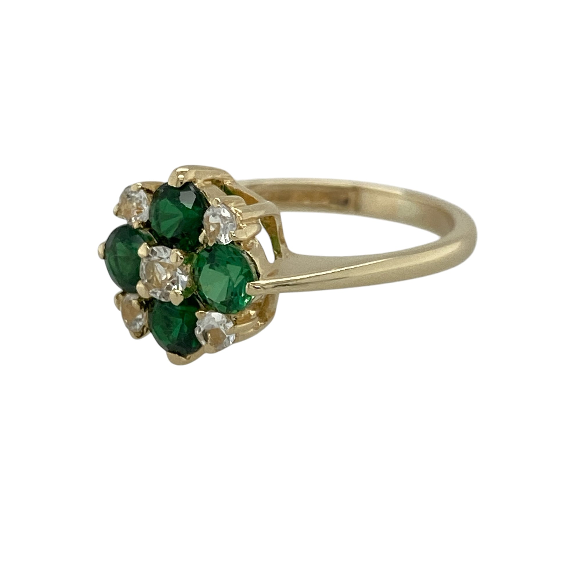 Add vibrant colour and floral elegance to your jewellery collection with this pre-owned 9ct yellow gold chrome diopside coloured stones and cubic zirconia set flower cluster ring—an eye-catching piece perfect for everyday wear or special occasions.

Design: This ring features a flower-inspired cluster design, set with rich green chrome diopside coloured stones surrounded by sparkling cubic zirconia for added brilliance. The 11mm high front creates a bold and decorative focal point.