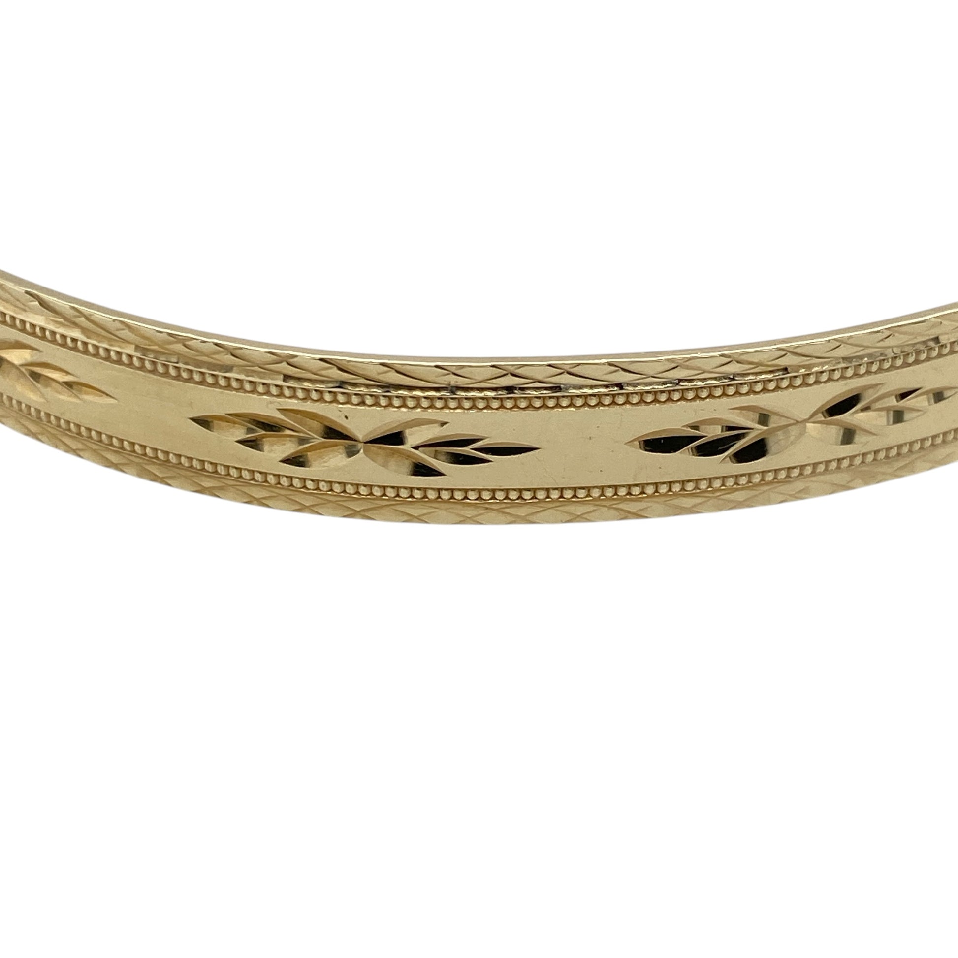Add classic style and practicality to your jewellery collection with this pre-owned 9ct yellow gold patterned expander bangle—an elegant piece designed for both comfort and everyday wear.

Design: This bangle features a detailed patterned finish across a 7mm wide band, creating a timeless and decorative look that catches the light beautifully.
Material: Made from 9-carat yellow gold, the polished finish enhances the intricate pattern while adding a rich and traditional appeal.