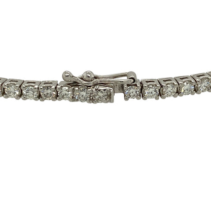 Add timeless luxury and exceptional sparkle to your jewellery collection with this pre-owned 18ct white gold diamond set tennis bracelet—an elegant and sophisticated piece perfect for special occasions or everyday refinement.

Design: This 7.25" tennis bracelet features a continuous row of sparkling diamonds, creating a sleek and fluid design that sits beautifully along the wrist with a classic and refined appearance.