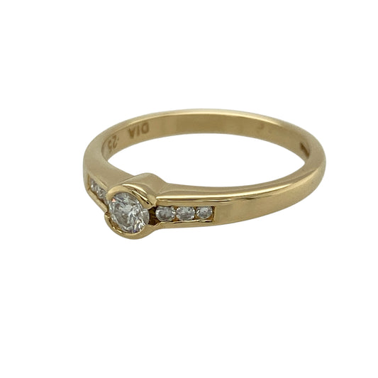 Add timeless elegance and extra sparkle to your jewellery collection with this pre-owned 18ct yellow gold diamond set solitaire ring—an exquisite piece perfect for special occasions or everyday luxury.

Design: This ring features a central brilliant-cut diamond, complemented by diamond set shoulders that enhance the overall sparkle and create a balanced, eye-catching look.