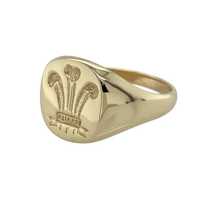 Add heritage-inspired style to your jewellery collection with this pre-owned 9ct yellow gold Welsh Three Feathers rounded rectangle signet ring—an iconic and meaningful piece with timeless appeal.

Design: This signet ring features a rounded rectangular face measuring approximately 13mm high, showcasing the classic Welsh Three Feathers emblem in a bold and distinguished design.
Material: Made from 9-carat yellow gold, the polished finish enhances the detailing while adding a rich and traditional tone.