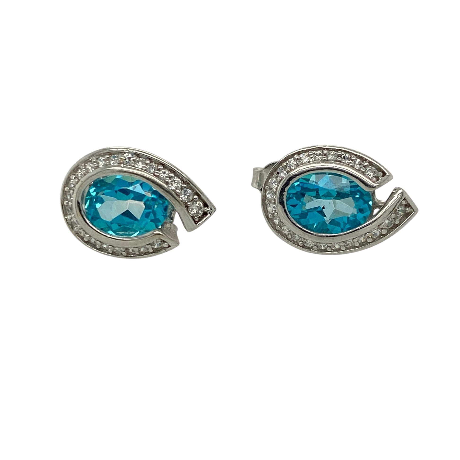 Add a touch of elegant colour and sparkle to your jewellery collection with these pre-owned 9ct white gold blue topaz and cubic zirconia set teardrop stud earrings—perfect for both everyday wear and special occasions.

Design: These stud earrings feature beautifully shaped teardrop designs set with oval blue topaz stones, each measuring approximately 8mm by 6mm, creating a bright and eye-catching focal point, enhanced by sparkling cubic zirconia accents.