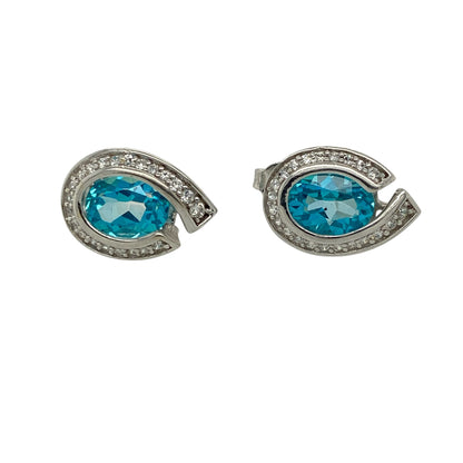 Add a touch of elegant colour and sparkle to your jewellery collection with these pre-owned 9ct white gold blue topaz and cubic zirconia set teardrop stud earrings—perfect for both everyday wear and special occasions.

Design: These stud earrings feature beautifully shaped teardrop designs set with oval blue topaz stones, each measuring approximately 8mm by 6mm, creating a bright and eye-catching focal point, enhanced by sparkling cubic zirconia accents.