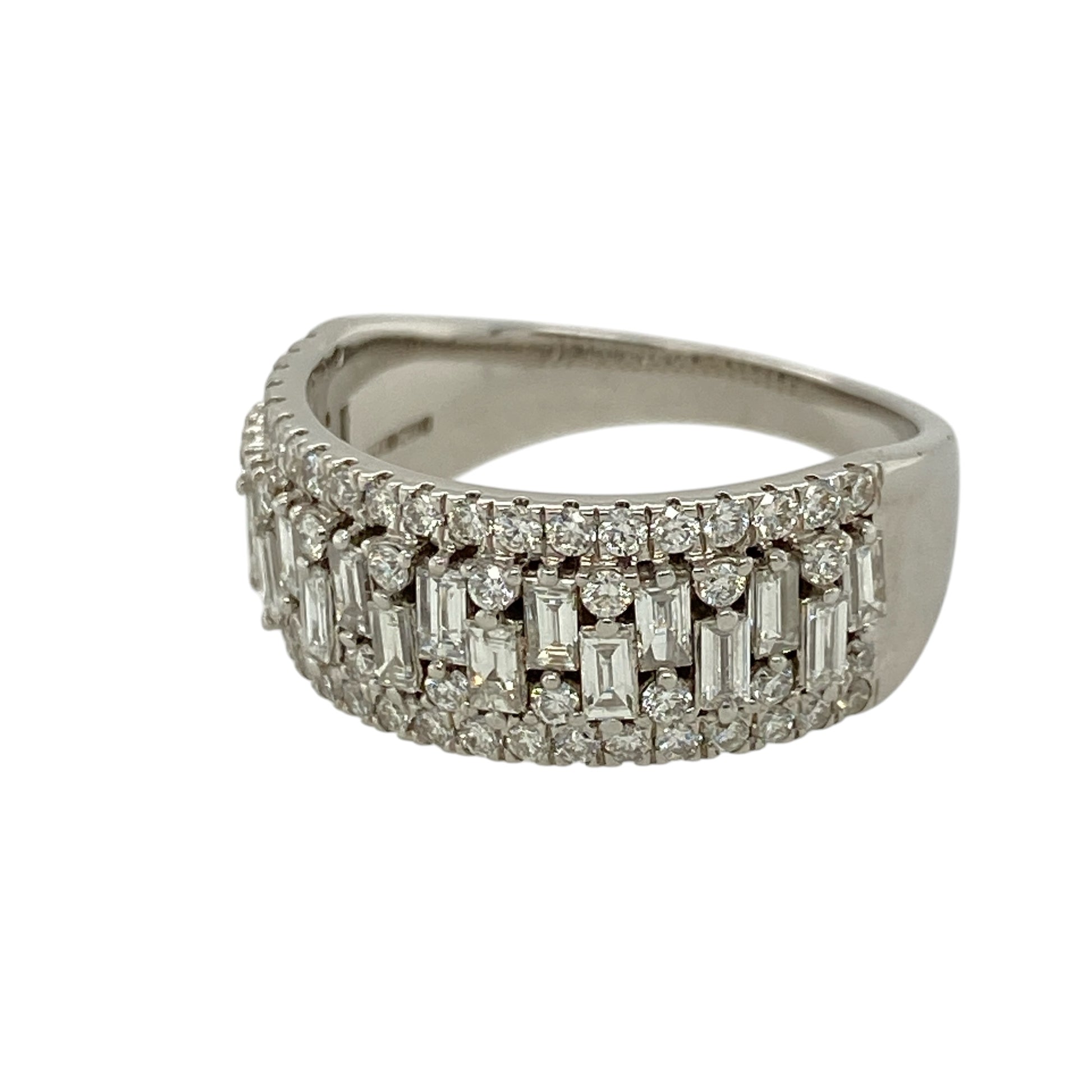 Add bold luxury and exceptional sparkle to your jewellery collection with this pre-owned 18ct white gold diamond set band ring—an eye-catching statement piece perfect for special occasions or everyday glamour.

Design: This ring features a wide 8mm front, set with a striking combination of baguette and brilliant-cut diamonds, creating a dynamic and textured look with impressive brilliance.
