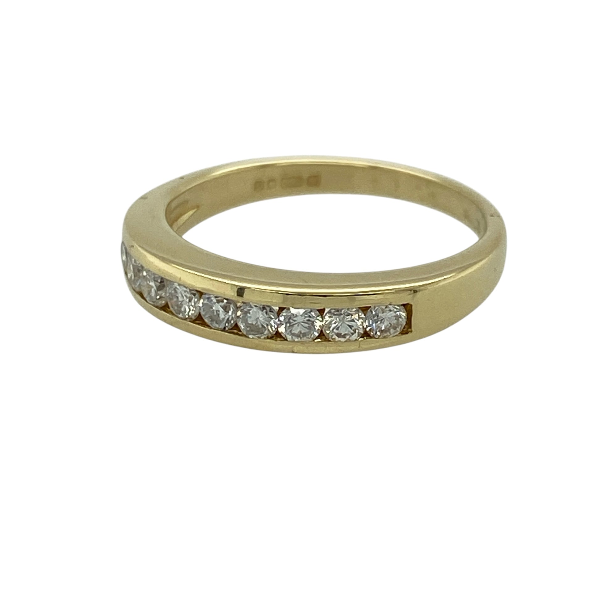 Add classic elegance and refined sparkle to your jewellery collection with this pre-owned 18ct yellow gold diamond set band ring—an elegant and versatile piece perfect for everyday wear or special occasions.

Design: This band ring features a sleek 4mm wide front, set with sparkling diamonds that create a clean and timeless look across the finger.
Material: Made from 18-carat yellow gold, the polished finish enhances the rich golden tone while complementing the brilliance of the diamonds.