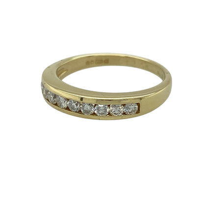 Add classic elegance and refined sparkle to your jewellery collection with this pre-owned 18ct yellow gold diamond set band ring—an elegant and versatile piece perfect for everyday wear or special occasions.

Design: This band ring features a sleek 4mm wide front, set with sparkling diamonds that create a clean and timeless look across the finger.
Material: Made from 18-carat yellow gold, the polished finish enhances the rich golden tone while complementing the brilliance of the diamonds.