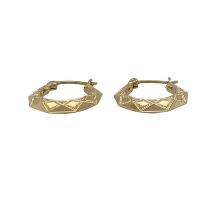Add a unique geometric touch to your jewellery collection with these pre-owned 9ct yellow gold patterned hexagon shaped creole earrings—an elegant and distinctive choice for everyday wear.

Design: These creole earrings feature a hexagon shape with a patterned finish, creating a modern and eye-catching look that adds subtle texture and dimension.
Material: Made from 9-carat yellow gold, the polished finish enhances the warm golden tone while highlighting the detailed pattern.