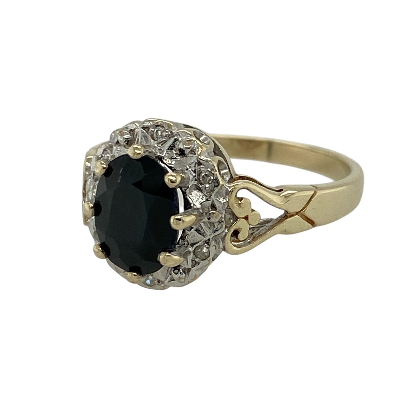 Add timeless elegance and rich colour to your jewellery collection with this pre-owned 9ct yellow gold diamond and sapphire set cluster ring—an eye-catching piece perfect for everyday wear or special occasions.

Design: This ring features a central oval sapphire measuring approximately 8mm by 6mm, surrounded by sparkling diamonds that create a classic and radiant cluster design.