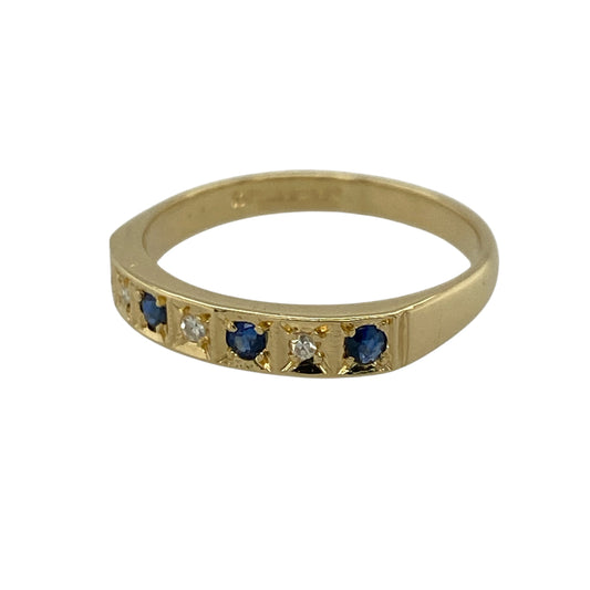 Add timeless elegance and refined sparkle to your jewellery collection with this pre-owned 18ct yellow gold diamond and sapphire set band ring—an understated yet eye-catching piece perfect for everyday wear.

Design: This band ring features a slim 3mm wide front, set with sparkling diamonds and rich blue sapphires, creating a balanced and elegant look across the finger.