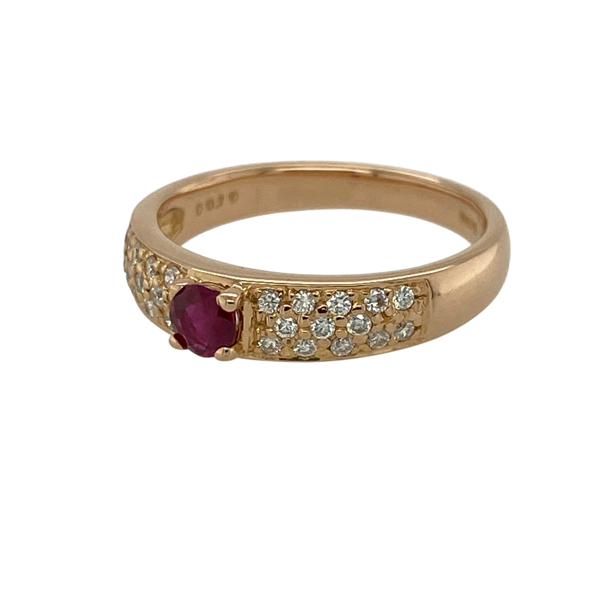 Add a touch of romantic colour and refined sparkle to your jewellery collection with this pre-owned 18ct rose gold diamond and ruby set band ring—an elegant piece perfect for everyday wear or special occasions.

Design: This ring features a central ruby measuring approximately 4mm in diameter, creating a rich and vibrant focal point, with multiple small diamonds set along half of the band for added brilliance and balance.