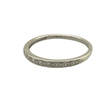 Add subtle sparkle and modern elegance to your jewellery collection with this pre-owned 9ct white gold diamond set band ring—an understated and versatile piece perfect for everyday wear.

Design: This band ring features a slim 2mm wide front, set with delicate diamonds that create a refined and minimalist look across the finger.
Material: Made from 9-carat white gold, the polished finish enhances the brilliance of the diamonds while offering a sleek and contemporary appearance.