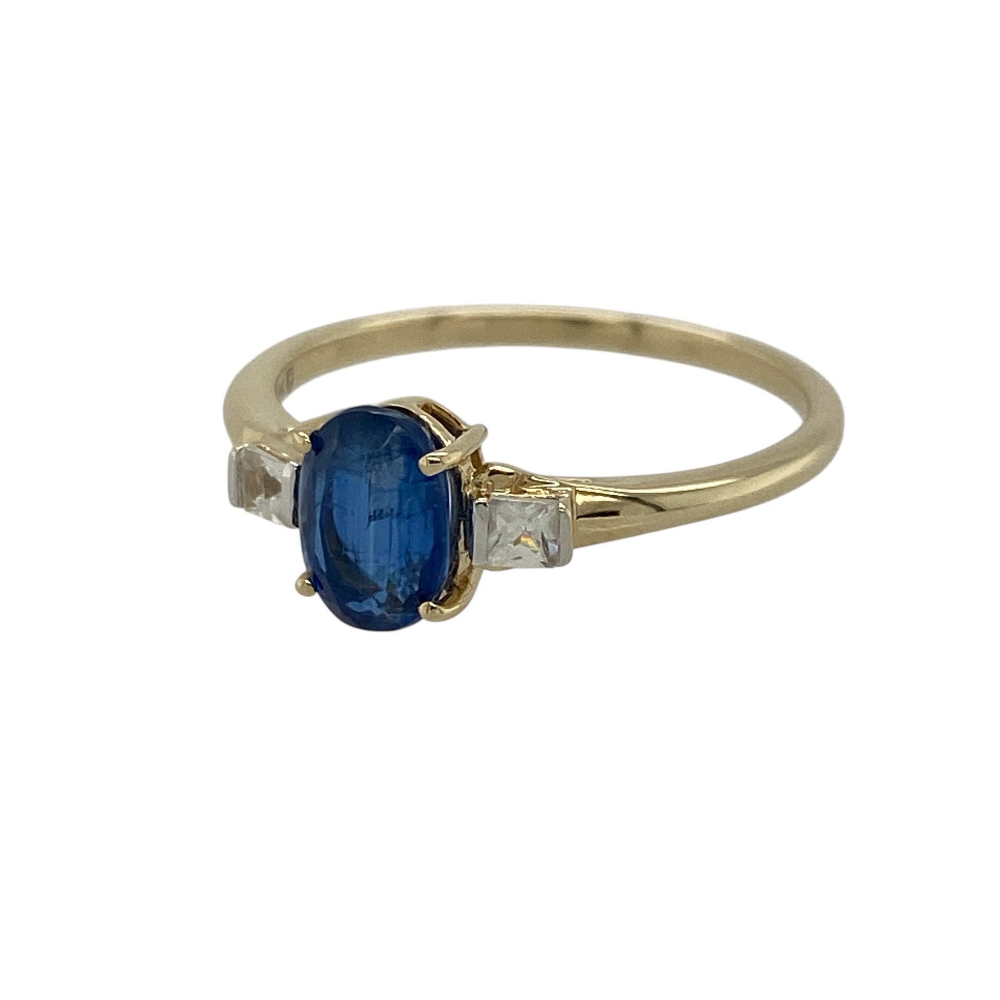 Add a touch of rich colour and subtle sparkle to your jewellery collection with this pre-owned 9ct yellow gold sapphire and cubic zirconia set ring—an elegant and versatile piece perfect for everyday wear.

Design: This ring features a central oval sapphire measuring approximately 7mm by 5mm, creating a vibrant focal point, complemented by sparkling cubic zirconia accents for added brilliance.