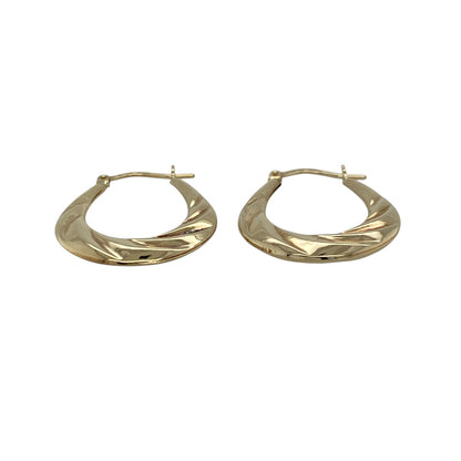 Add a touch of elegance and subtle texture to your jewellery collection with these pre-owned 9ct yellow gold twisted oval creole earrings—an easy-to-wear and stylish choice for everyday wear.

Design: These creole earrings feature a graceful oval shape with a twisted finish, creating a light-catching effect that adds depth and visual interest.
Material: Made from 9-carat yellow gold, the polished finish enhances the warm golden tone while highlighting the intricate twist detail.