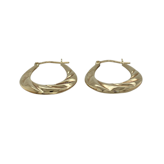 Add a touch of elegance and subtle texture to your jewellery collection with these pre-owned 9ct yellow gold twisted oval creole earrings—an easy-to-wear and stylish choice for everyday wear.

Design: These creole earrings feature a graceful oval shape with a twisted finish, creating a light-catching effect that adds depth and visual interest.
Material: Made from 9-carat yellow gold, the polished finish enhances the warm golden tone while highlighting the intricate twist detail.
