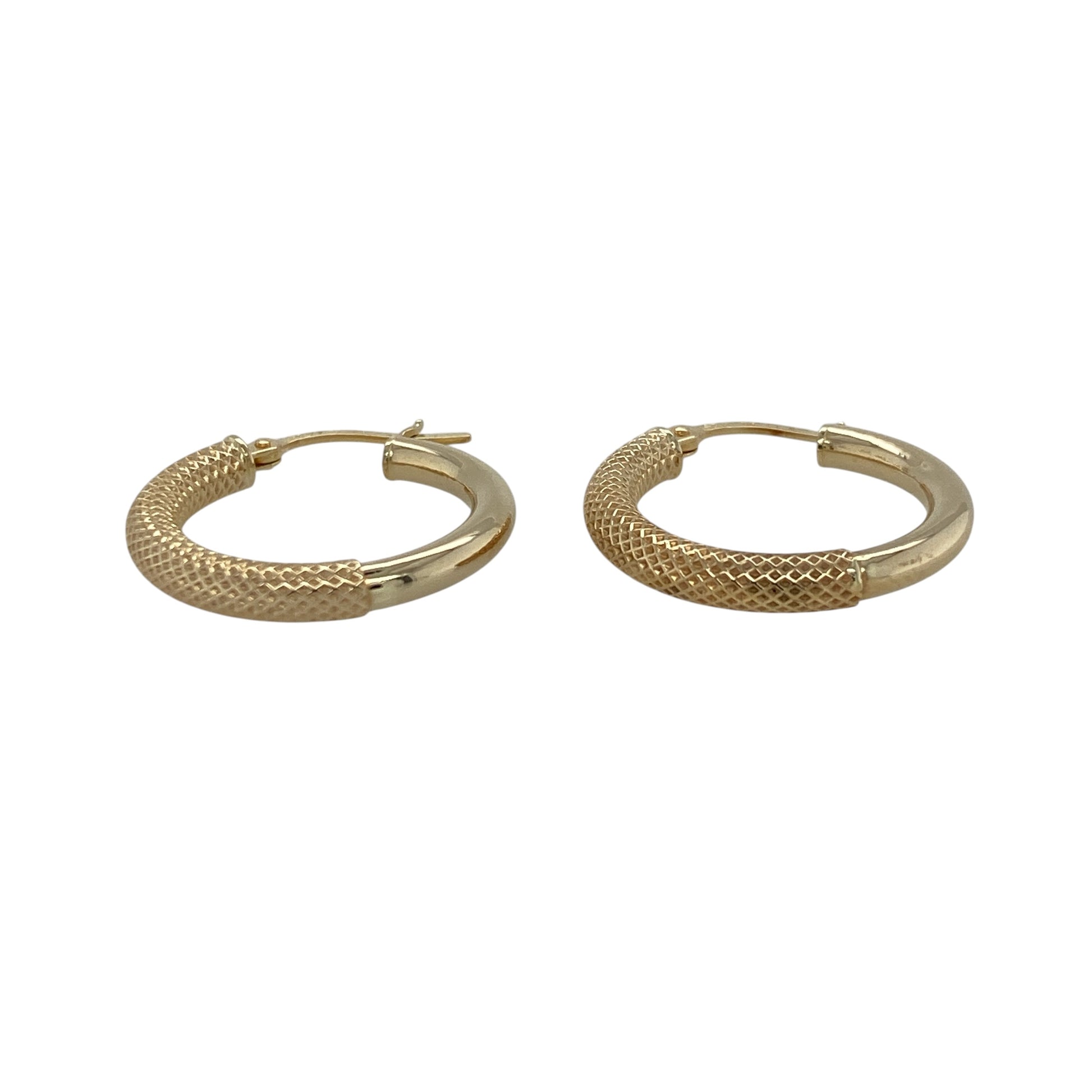 Add a touch of contrast and texture to your jewellery collection with these pre-owned 9ct yellow gold half textured half plain hoop creole earrings—an elegant and versatile choice for everyday wear.

Design: These hoop creole earrings feature a unique half textured, half plain design, combining smooth polished gold with a light-catching textured finish for a subtle yet eye-catching look.