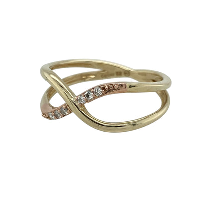 Add a romantic and meaningful touch to your jewellery collection with this pre-owned 9ct yellow and rose gold diamond set Clogau “Forever Yours Kiss” crossover ring—an elegant piece perfect for everyday wear or gifting.

Design: This ring features a graceful crossover design with a 9mm high front, symbolising a kiss or embrace, enhanced with sparkling diamonds for added brilliance.