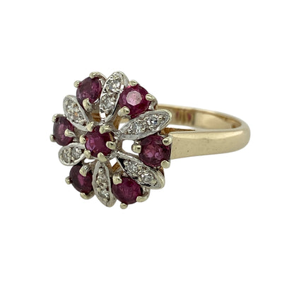 Add bold colour and timeless elegance to your jewellery collection with this pre-owned 9ct yellow and white gold diamond and ruby set flower cluster ring—an eye-catching statement piece perfect for special occasions.

Design: This ring features a striking flower cluster design with a 16mm high front, set with rich red rubies and surrounded by sparkling diamonds to create a beautifully detailed and vibrant focal point.