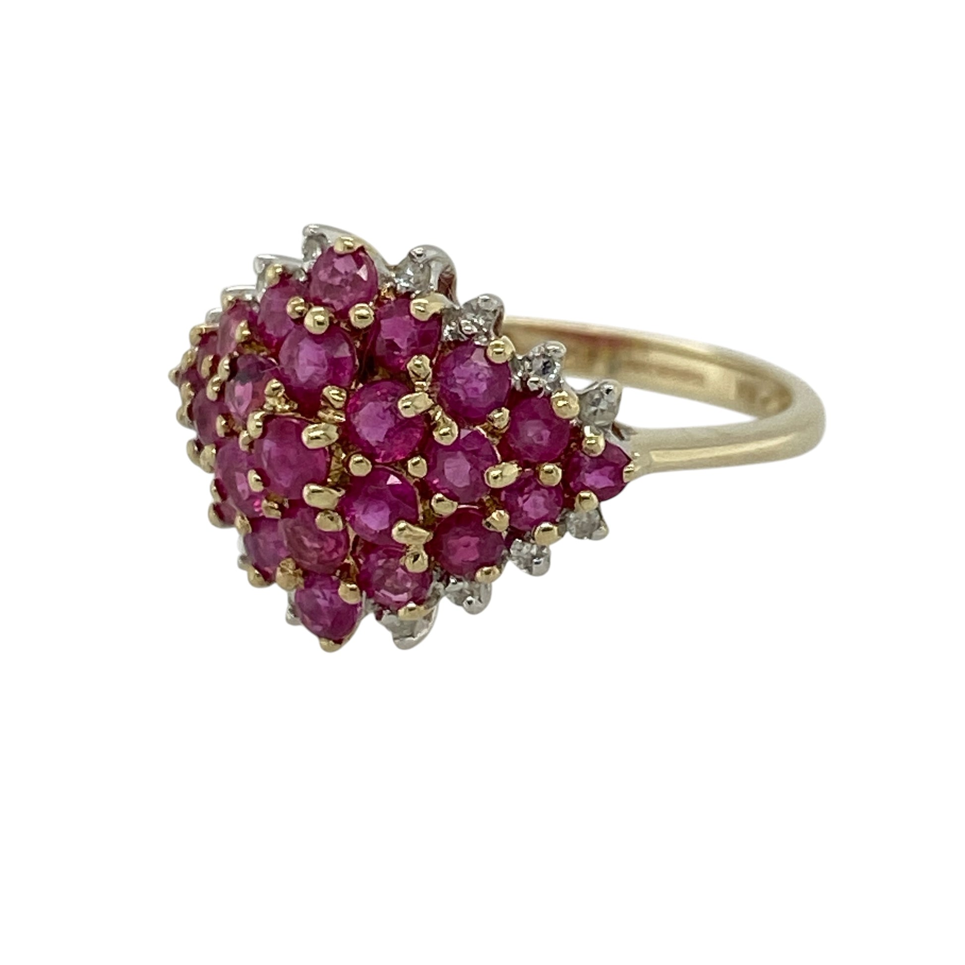Add vibrant colour and elegant sparkle to your jewellery collection with this pre-owned 9ct yellow gold diamond and ruby set cluster ring—an eye-catching piece perfect for everyday wear or special occasions.

Design: This ring features a bold 13mm high cluster front, set with round ruby gemstones at the centre, surrounded by small sparkling diamonds along the edges for a beautifully balanced and radiant finish.