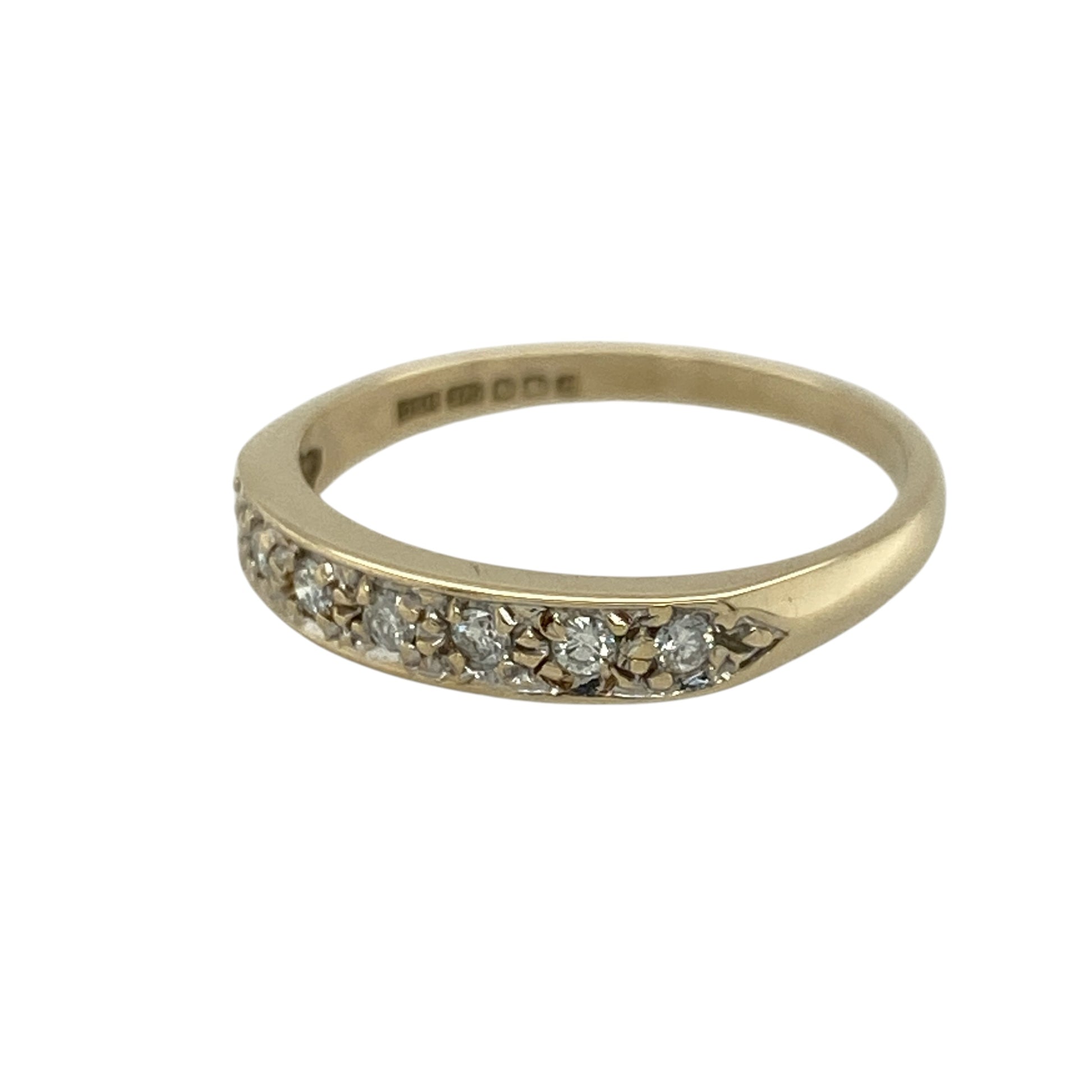Add subtle sparkle and timeless style to your jewellery collection with this pre-owned 9ct yellow gold diamond set band ring—an elegant and versatile piece perfect for everyday wear.

Design: This ring features a 3mm wide front, set with sparkling diamonds that create a refined and balanced look across the band.
Material: Made from 9-carat yellow gold, the polished finish enhances the warm golden tone while complementing the brilliance of the diamonds.