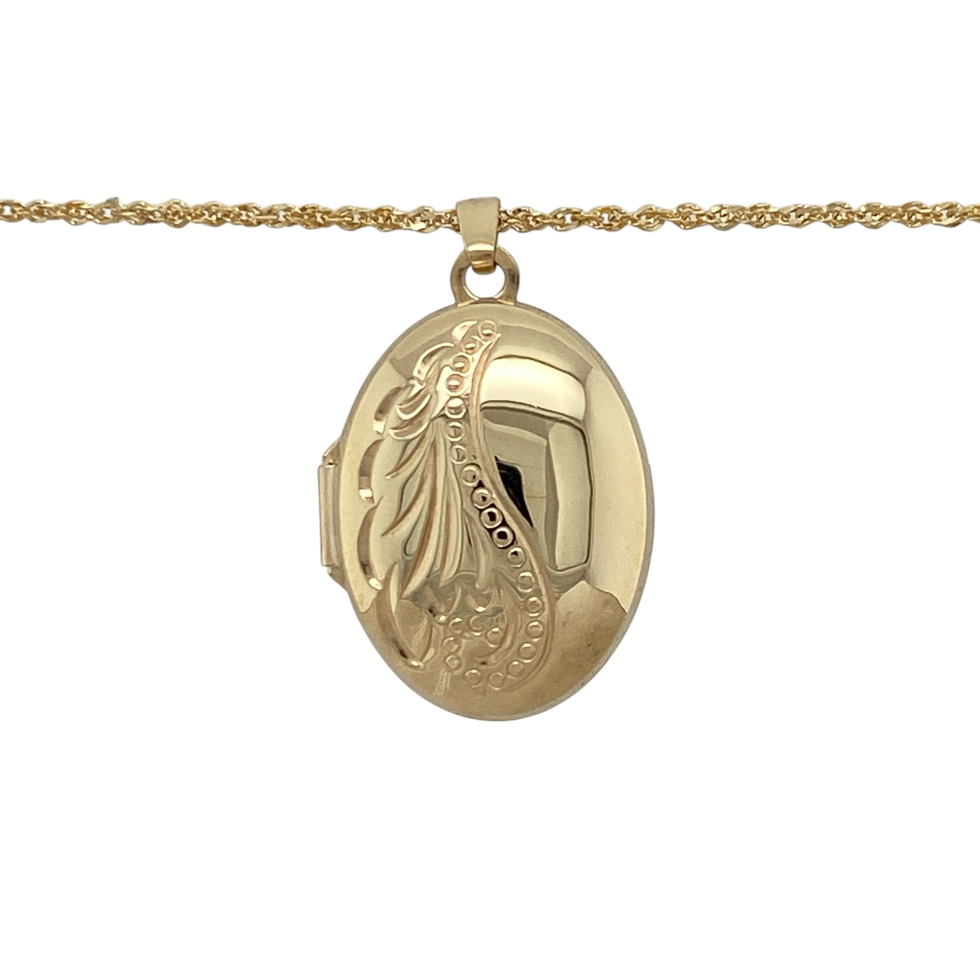 Add timeless sentiment to your jewellery collection with this pre-owned 9ct yellow gold oval locket necklace, featuring a patterned finish and classic design—perfect for everyday wear or a meaningful gift.

Design: The necklace features an oval-shaped locket with a decorative patterned surface, offering a traditional and elegant look that never goes out of style.
Material: Made from 9ct yellow gold, the polished finish enhances the warm tone of the metal, giving a refined and versatile appearance.