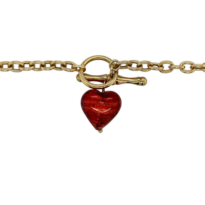 Add a bold pop of colour to your jewellery collection with this pre-owned 9ct yellow gold red heart bead belcher T-bar necklace, featuring a striking design and classic styling—perfect for statement wear or everyday elegance.

Design: The necklace features a vibrant red glass heart bead measuring approximately 12mm, creating a standout focal point against the classic belcher chain.