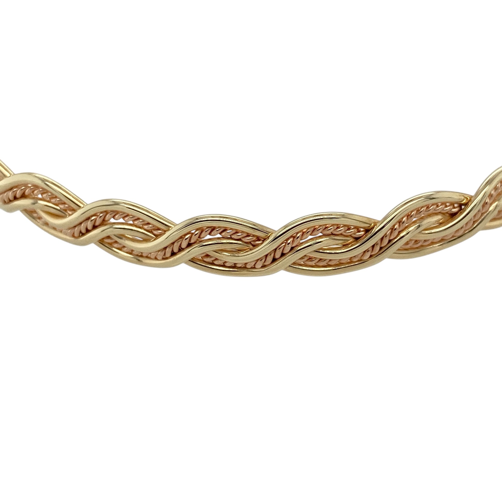 Add heritage-inspired elegance to your jewellery collection with this pre-owned 9ct yellow gold Welsh Gold Cymru twist bangle, featuring a distinctive woven design—perfect for everyday wear or a standout statement piece.

Design: The bangle showcases a metal weave twist style, creating an interlaced effect that adds texture and visual depth with a refined, traditional feel.