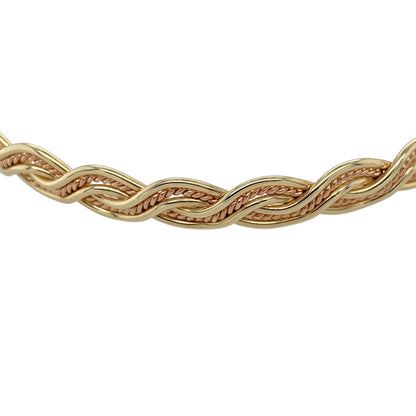 Add heritage-inspired elegance to your jewellery collection with this pre-owned 9ct yellow gold Welsh Gold Cymru twist bangle, featuring a distinctive woven design—perfect for everyday wear or a standout statement piece.

Design: The bangle showcases a metal weave twist style, creating an interlaced effect that adds texture and visual depth with a refined, traditional feel.