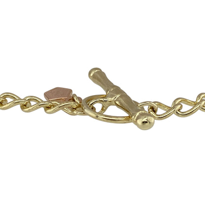 Add heritage style to your jewellery collection with this pre-owned 9ct yellow gold Clogau curb charm bracelet, featuring a classic design with a traditional T-bar fastening—perfect for everyday wear or showcasing your favourite charms.

Design: The bracelet features a timeless curb link design, offering a smooth, flat profile that sits comfortably on the wrist while catching the light with subtle shine.