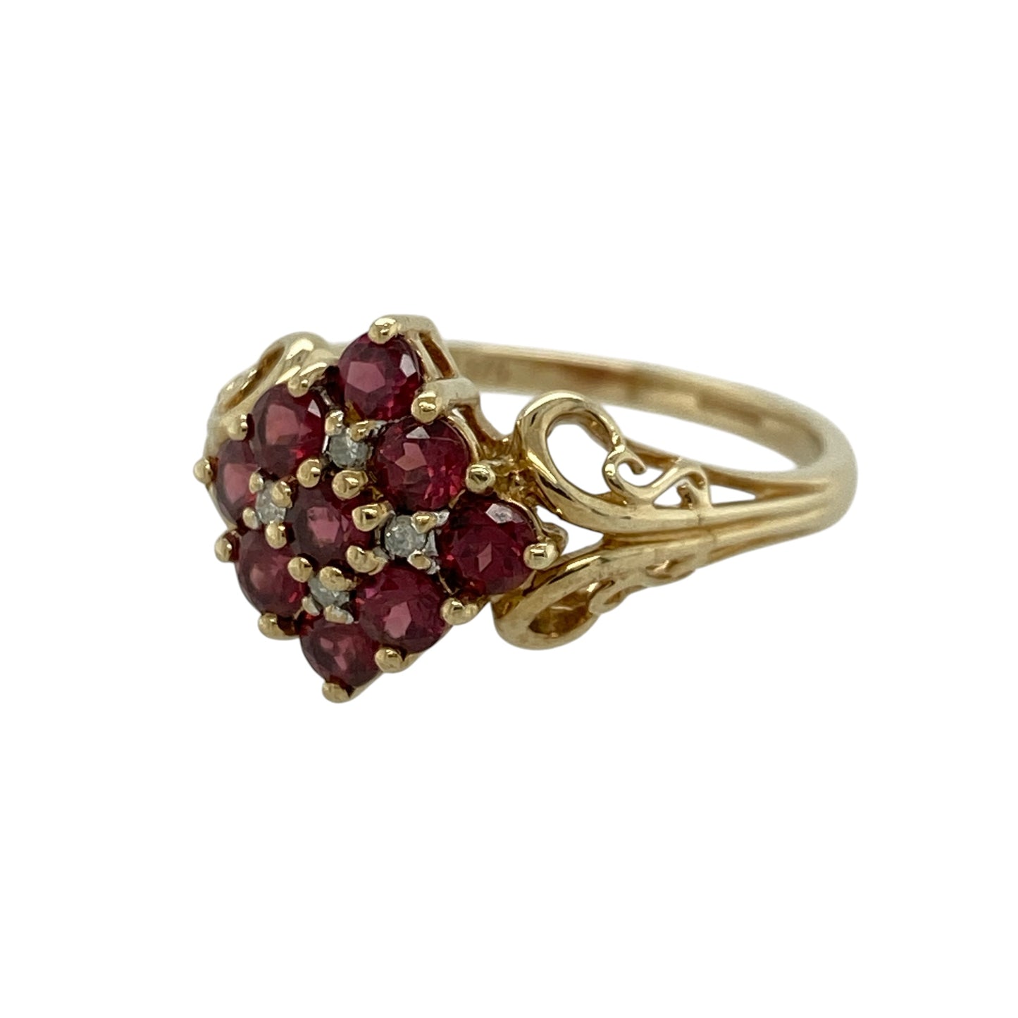 Add rich colour and classic elegance to your jewellery collection with this pre-owned 9ct yellow gold diamond and ruby cluster ring, featuring a bold floral-inspired design—perfect for special occasions or standout everyday wear.

Design: The ring features a cluster of nine round rubies, each approximately 3mm, arranged to create a striking and vibrant focal point, with small diamonds set in between adding extra sparkle and contrast.
